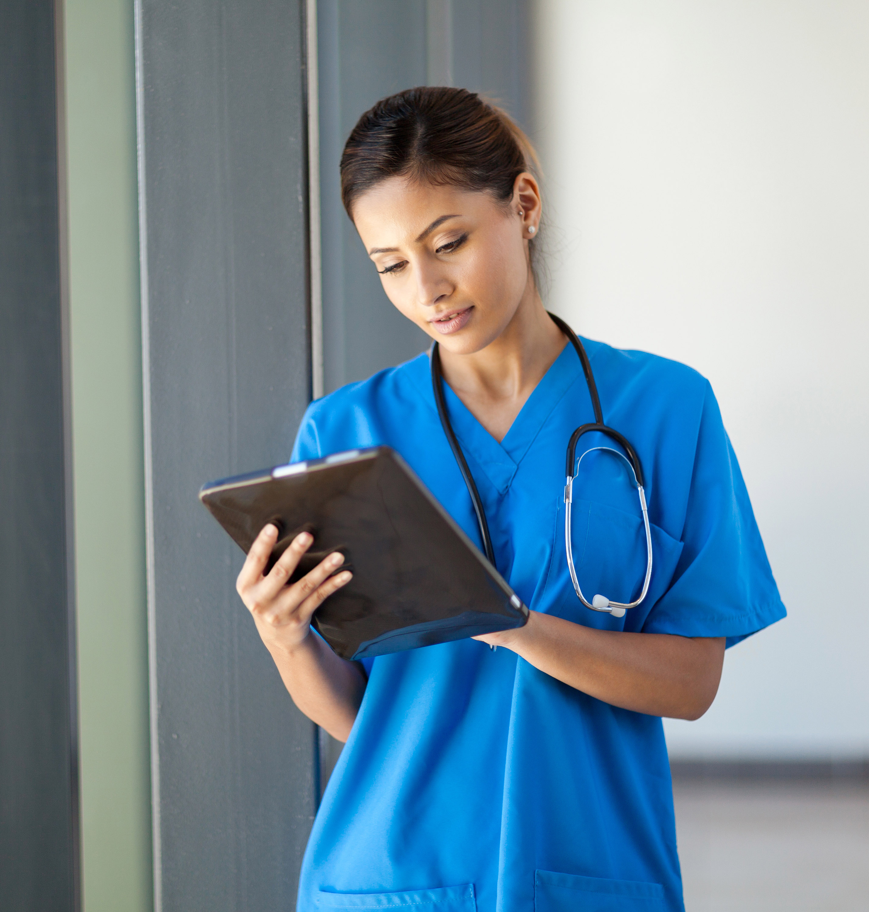 A nurse holding a medical clipboard